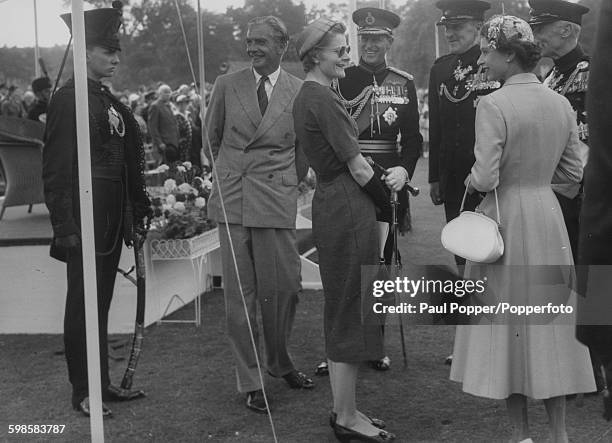 Queen Elizabeth II and the Duke of Edinburgh talking to Prime Minister, Sir Anthony Eden and Lady Eden at the Bicentenary Parade of the King's Royal...