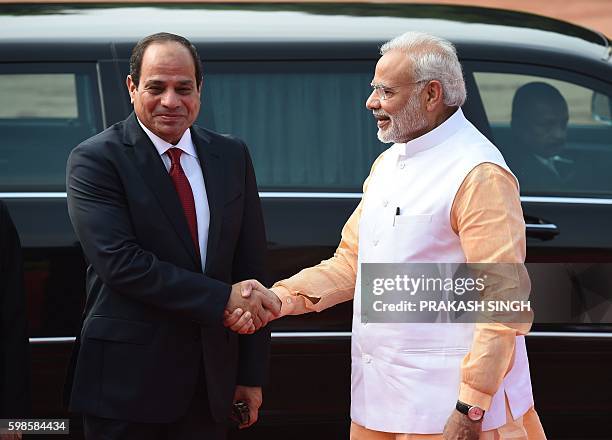 India Prime Minister Narendra Modi shakes hands with President of the Arab Republic of Egypt Abdel Fattah El-Sisi during ceremonial reception at...