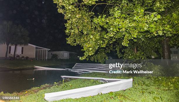 Metal roof lies in the road as the eye of Hurricane Hermine passes overhead in the early morning hours on September 2, 2016 in Shell Point Beach,...