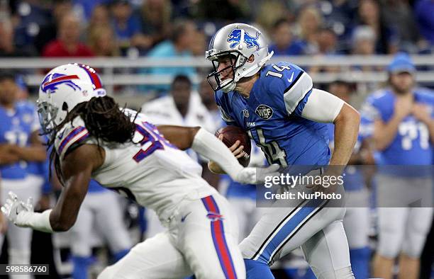 Detroit Lions quarterback Jake Rudock runs the ball during the second half of an NFL football game against the Buffalo Bills in Detroit, Michigan...