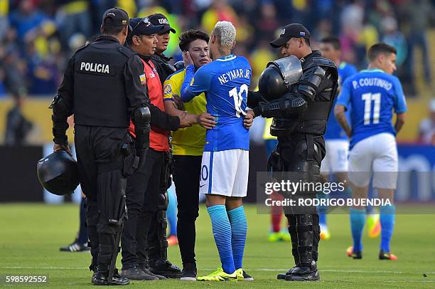 An Ecuador fan embraces Brasil's Neymar Jr after their 2018 FIFA World Cup qualifying football match between Ecuador and Brazil at the Atahualpa...