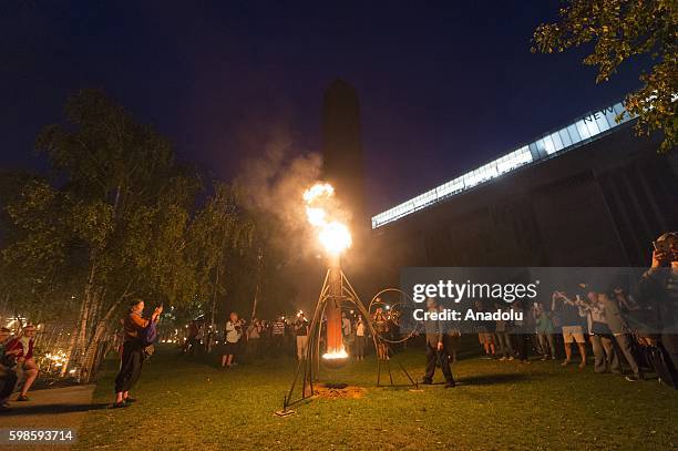 Fire Garden event, transforming the front lawn of the Tate Modern into a crackling, after-dark adventure made from burning structures, cascading...
