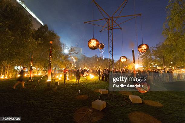 Fire Garden event, transforming the front lawn of the Tate Modern into a crackling, after-dark adventure made from burning structures, cascading...