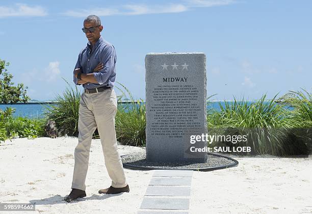President Barack Obama visits the Battle of Midway Navy Memorial during a tour of Midway Atoll in the Papahanaumokuakea Marine National Monument in...