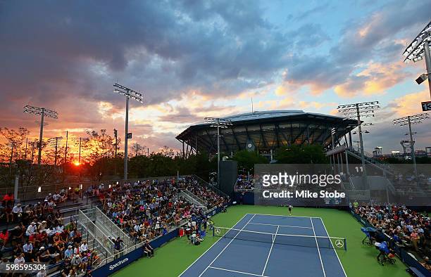 Viktor Troicki of Serbia serves against Jared Donaldson of the United States in their second round Men's Singles match on Day Four of the 2016 US...
