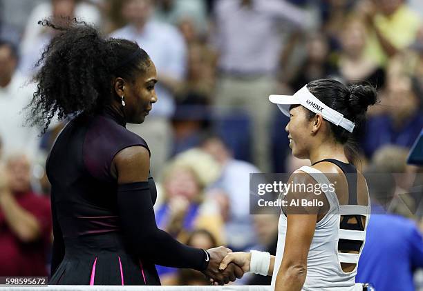 Serena Williams of the United States shakes hands with Vania King of the United States after their second round Women's Singles match on Day Four of...