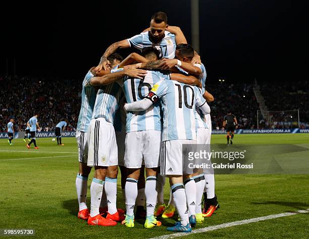 Lionel Messi of Argentina celebrates with teammates after scoring the first goal of his team during a match between Argentina and Uruguay as part of...