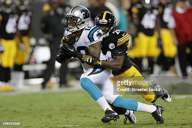 Damiere Byrd of the Carolina Panthers runs the ball against Doran Grant of the Pittsburgh Steelers in the 1st quarter during their game at Bank of...