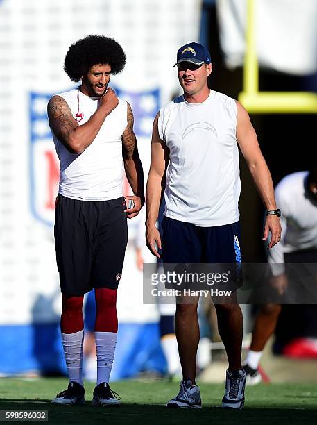 Colin Kaepernick of the San Francisco 49ers and Philip Rivers of the San Diego Chargers talk on the field before a preseason game at Qualcomm Stadium...