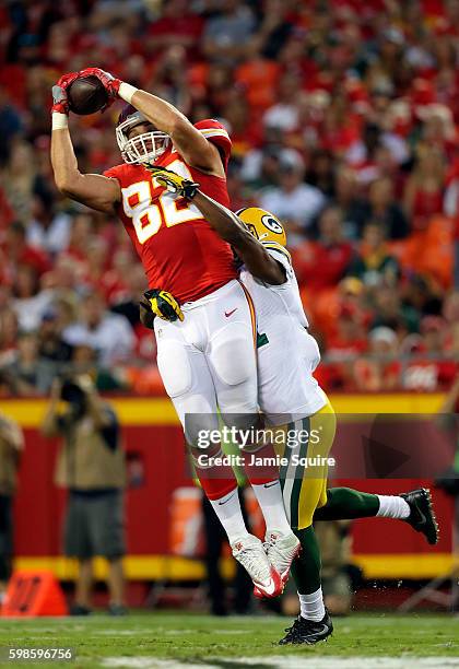 Brian Parker of the Kansas City Chiefs catches a pass a Robertson Daniel of the Green Bay Packers defends during the preseason game at Arrowhead...