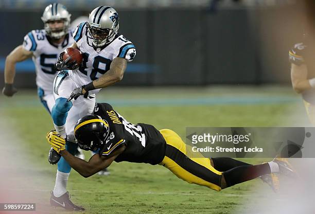 Damiere Byrd of the Carolina Panthers runs the ball against Sean Davis of the Pittsburgh Steelers in the 2nd quarter during their game at Bank of...