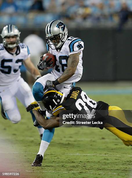 Damiere Byrd of the Carolina Panthers runs the ball against Sean Davis of the Pittsburgh Steelers in the 2nd quarter during their game at Bank of...