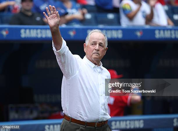 Former general manager of the Toronto Blue Jays and member of the National Baseball Hall of Fame Pat Gillick acknowledges the crowd before throwing...