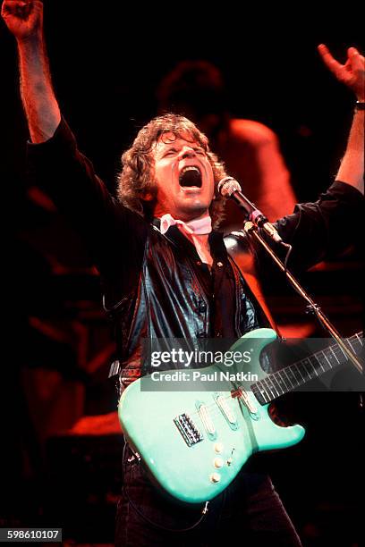 American Rock musician John Fogerty plays guitar as he performs onstage at the Poplar Creek Music Theater, Hoffman Estates, Illinois, September 25,...