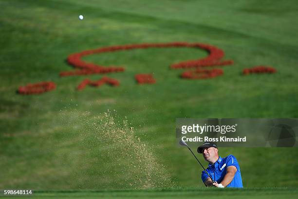 Graeme Storm of England plays his second shot from a bunker on the seventh hole during the second round of the Omega European Masters at...