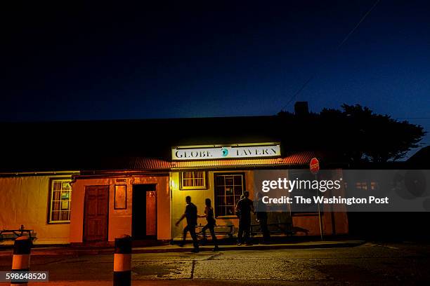 Just after sunset, patrons gather for food, fun, dancing and drinks at the Globe Tavern on Saturday, February 6 in Stanley, Falkland Islands.