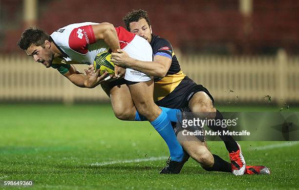 Harry Jones of the Rays is tackled during the round two NRC match between the Sydney Rays and the Perth Spirit at North Sydney Oval on September 2,...