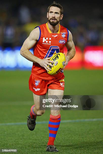 Jason Akermanis of the All Stars looks upfield in the warm up during the EJ Whitten Legends match at Etihad Stadium on September 2, 2016 in...