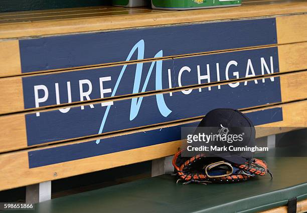Detailed view of the baseball hat and glove of Miguel Cabrera of the Detroit Tigers sitting in the dugout prior to the game against the Los Angeles...