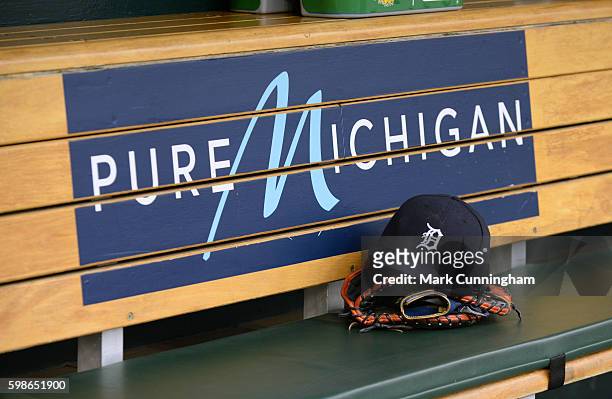 Detailed view of the baseball hat and glove of Miguel Cabrera of the Detroit Tigers sitting in the dugout prior to the game against the Los Angeles...