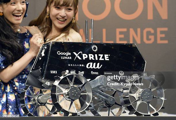 New model of the lightweight moon rover developed by Japan's Team HAKUTO for the Google Lunar XPrize competition is unveiled to the media in Tokyo on...