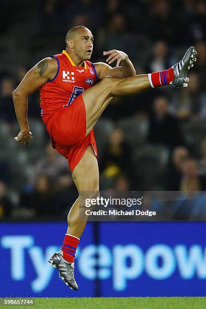 Andrew McLeod of the All Stars kicks the ball for a supergoal during the EJ Whitten Legends match at Etihad Stadium on September 2, 2016 in...