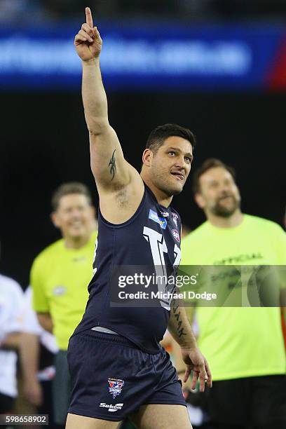 Brendan Fevola of Victoria celebrates a goal to win for the team in a shoot out during the EJ Whitten Legends match at Etihad Stadium on September 2,...