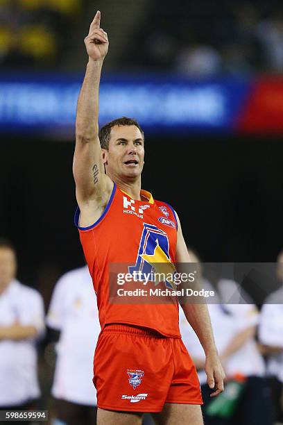 Wayne Carey of the All Stars celebrates a goal prematurely when he kicks the ball for goal but ends up missing in the shootout during the EJ Whitten...