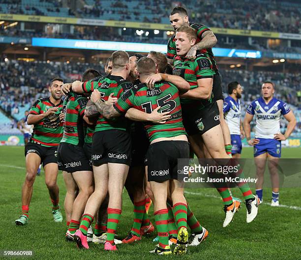 Aaron Gray of the Rabbitohs celebrates with teammates after scoring a try during the round 26 NRL match between the Canterbury Bulldogs and the South...