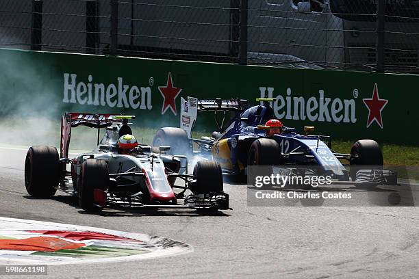 Esteban Gutierrez of Mexico driving the Haas F1 Team Haas-Ferrari VF-16 Ferrari 059/5 turbo locks a wheel under braking next to Felipe Nasr of Brazil...