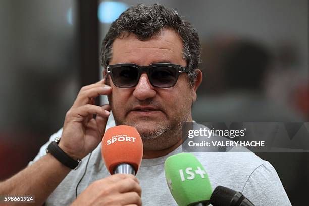 Italian-born Dutch football agent Mino Raiola speaks to journalists on September 2, 2016 during presentation of Nice's football club new signings at...