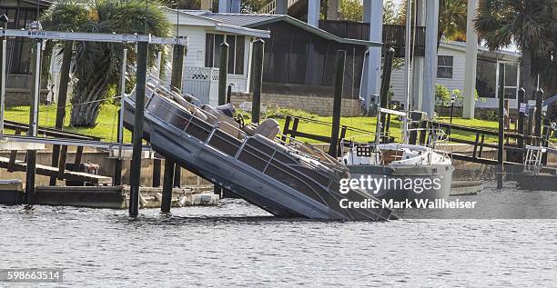 Recreational boat is off its mooring after Hurricane Hermaine came ashore on September 2, 2016 in Shell Point Beach, Florida. Hermine made landfall...