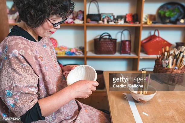 japanese craftsperson making a paper bowl - papier stock pictures, royalty-free photos & images