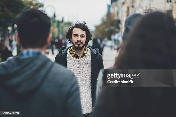 man in the crowd - crowd of people walking stock pictures, royalty-free photos & images