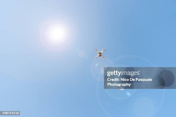 drone flying - camera lens flare stock pictures, royalty-free photos & images