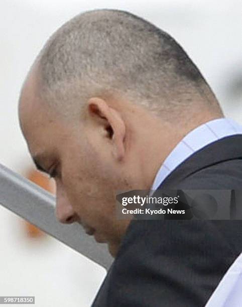 Japan - Govinda Prasad Mainali, a Nepalese man granted a retrial over a 1997 Tokyo murder case, climbs up the stairs into an airplane at Narita...