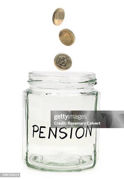 beginning to save for a pension - moeda de uma libra imagens e fotografias de stock