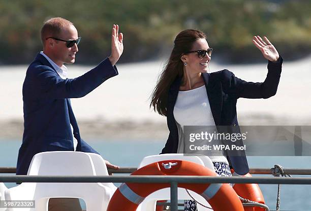 Prince William, Duke of Cambridge and Catherine, Duchess of Cambridge travel by boat to St Martins, after visiting Tresco Abbey Garden on September...