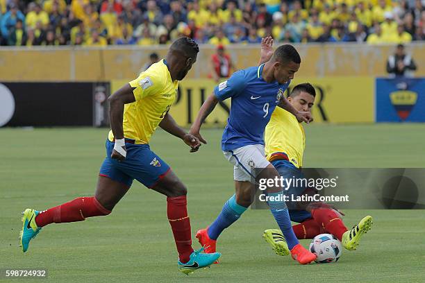 Gabriel Jesus of Brazil battles a ball with Christian Noboa and Gabriel Achilier of Ecuador during a match between Ecuador and Brazil as part of FIFA...