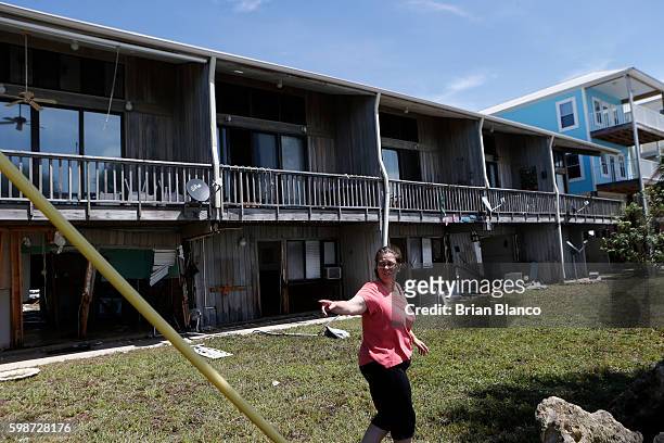 Resident surveys damage to property left behind by the winds and storm surge associated with Hurricane Hermine which made landfall overnight in the...