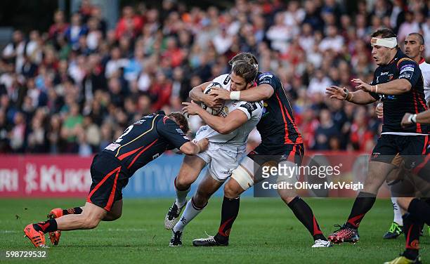 Northern Ireland , Ireland - 2 September 2016; Stuart McCloskey of Ulster is tackled by Rhys Thomas and Ed Jackson of Newport Gwent Dragons during...