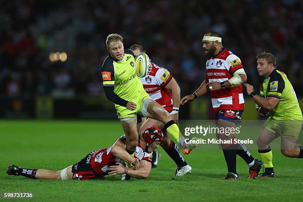Mathew Tait of Leicester escapes the challenge from Tom Savage of Gloucester during the Aviva Premiership match between Gloucester and Leicester...