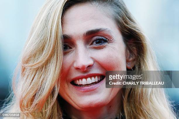 French actress Julie Gayet poses on the red carpet before the opening ceremony of the 42nd Deauville US Film Festival on September 2, 2016 in the...