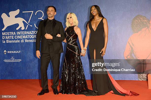 Riccardo Tisci, Donatella Versace and Naomi Campbell attend the premiere of 'Franca: Chaos And Creation' during the 73rd Venice Film Festival at Sala...