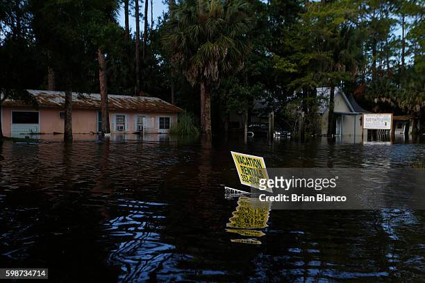 Homes sit in several feet of water left behind by the storm surge associated with Hurricane Hermine which made landfall overnight in the area on...