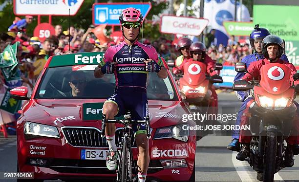 Lampre Merida's Italian cyclist Valerio Conti celebrates winning as he crosses the finish line during the 13th stage of the 71st edition of "La...