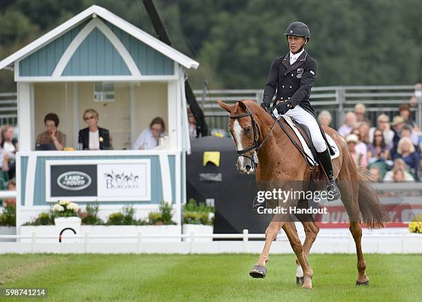 Andrew Nicholson of New Zealand and Nereo sitting in third after the first dressage after he is making a comeback after a serious head injury in...