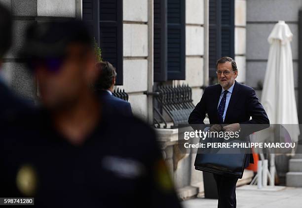Spain's interim Prime Minister, Mariano Rajoy arrives at the Spanish Congress on September 2 in Madrid to attend the third day of a parliamentary...