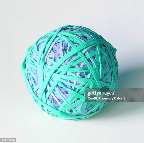 ball created with colourful elastic bands - elastic band ball stock pictures, royalty-free photos & images