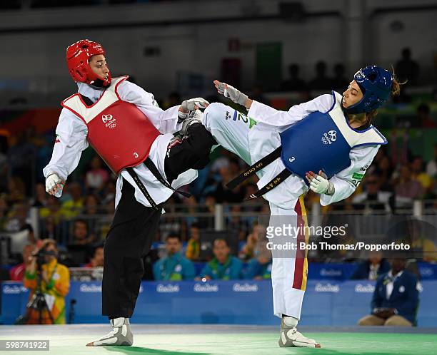 Eva Calvo Gomez of Spain in action against Kimia Alizadeh Zenoorin of Iran during the Women's Taekwondo 57kg quarter finals at the Carioca Arena on...